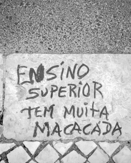 a cement wall with graffiti written on it — Foto por Manuel Palmeira na Unsplash
